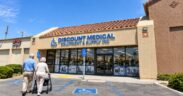 Discount-Medical-–-Mobility-Equipment-Supplies-storefront-in-Costa-Mesa-California-with-an-older-couple-walking-toward-the-medical-supply-store-using-a-rollator.